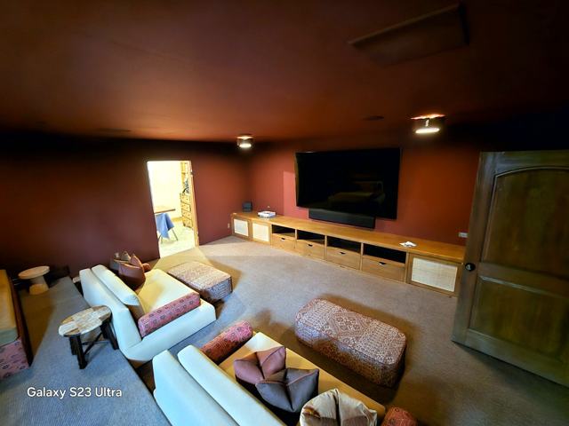 Oxblood media lounge: Warm walls, big screen