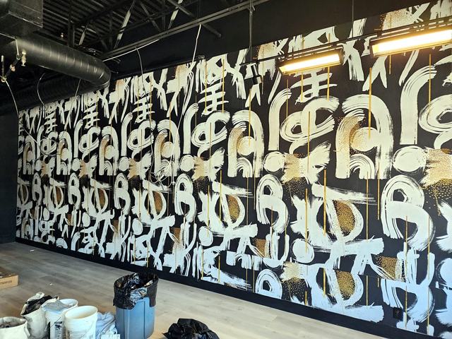 Calligraffiti mural — training gym: Full-wall mural on the training floor