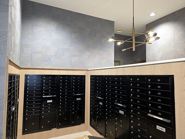 Residence clubhouse — amenity floor: Mail nook under the chandelier