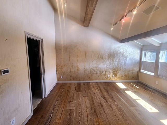 Cork-wrapped study: Natural cork walls, barnwood floor