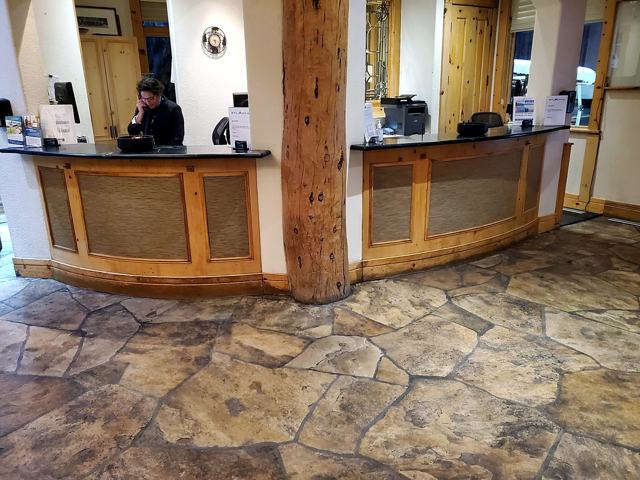 Lodge front desk: Woven panels wrap the desk
