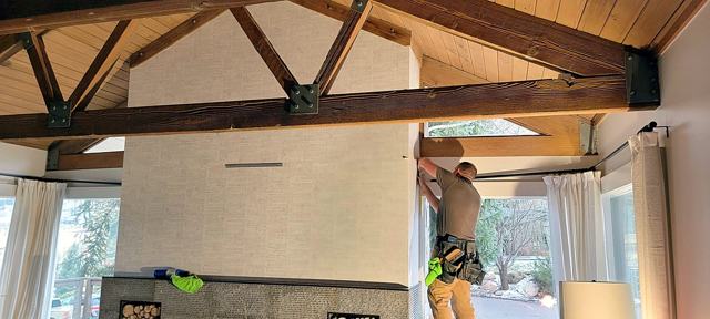 Grasscloth under timber trusses: Working the vaulted gable