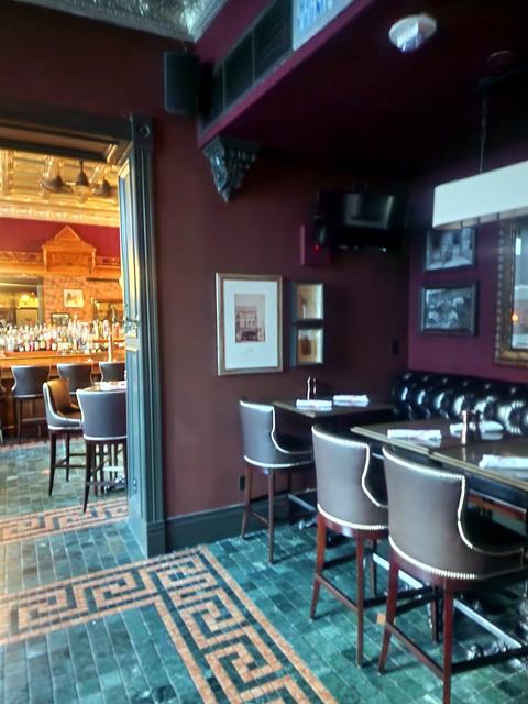 Historic hotel bar — restored: Dining nook under the tin ceiling