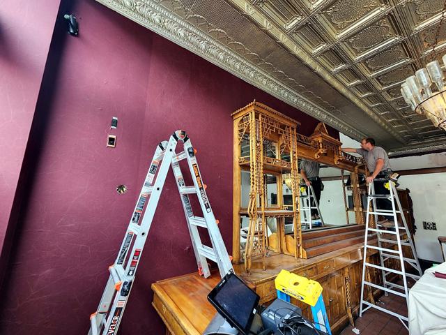Historic hotel bar — restored: Hanging the oxblood walls