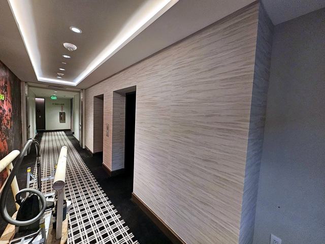Travertine-look corridors — hotel: Corridor run