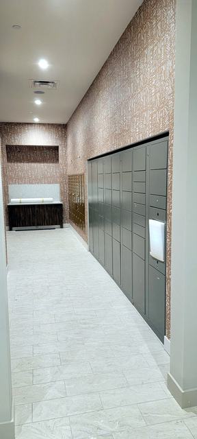 Mail room & block-print wall — commercial: Mail room with lockers