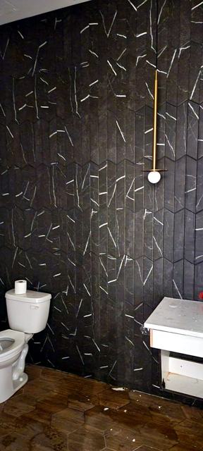 Mail room & block-print wall — commercial: Branch-pattern powder room, same building