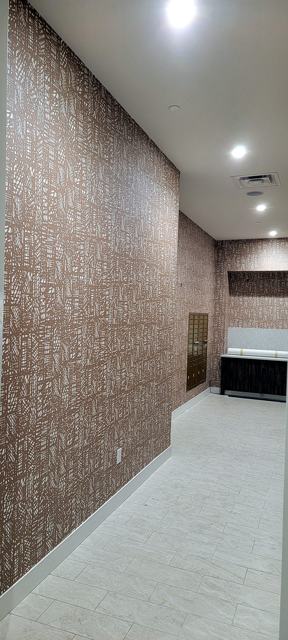 Mail room & block-print wall — commercial: Corridor view