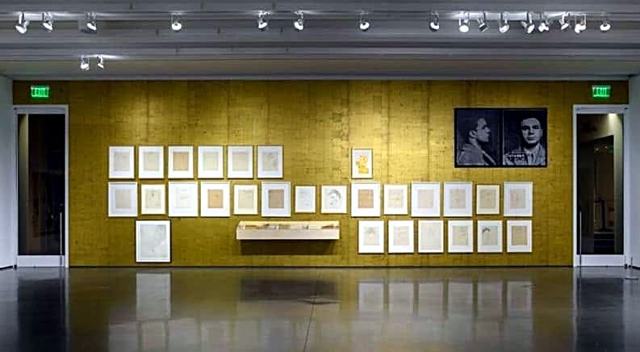 Museum exhibition — Aspen: Gold-papered gallery wall