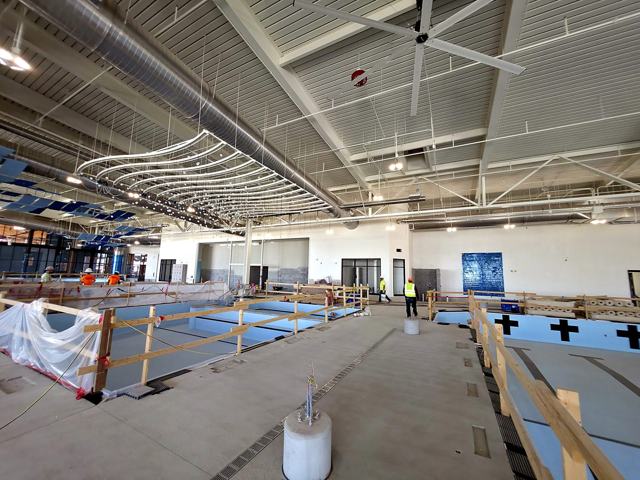 Acoustic ceiling panels — aquatic center: Panel rows going in