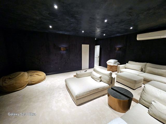 Suede-finish home theater: Deep charcoal walls and ceiling